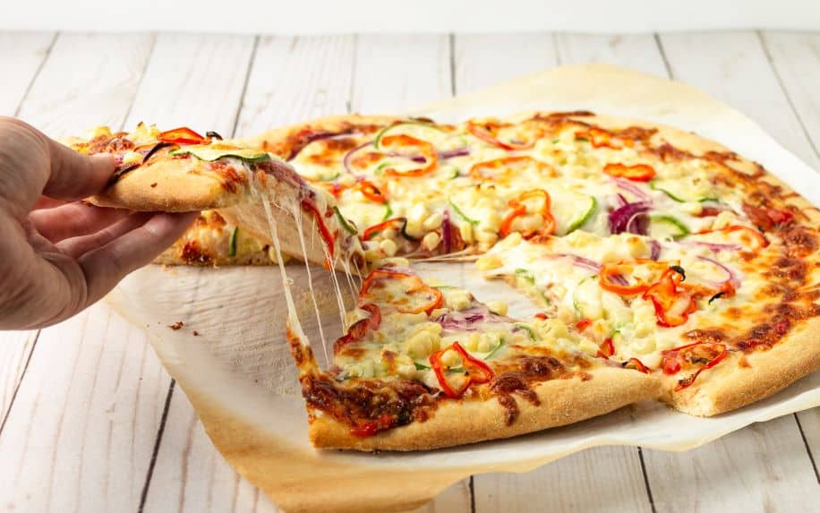 A cheese pull on a pizza is a great way to get restaurant video marketing content.
