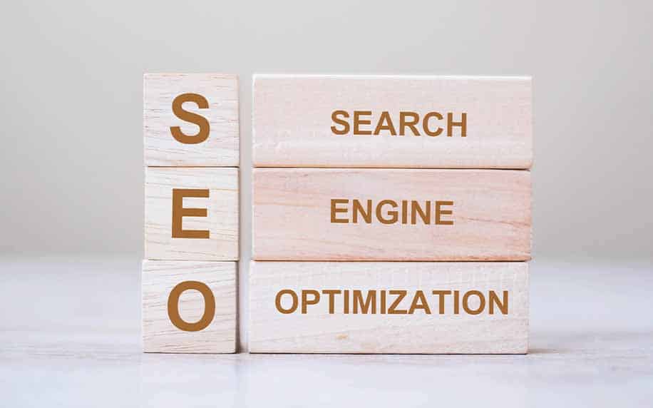 wooden blocks spelling out seo fully as search engine optimisationSEO content strategy